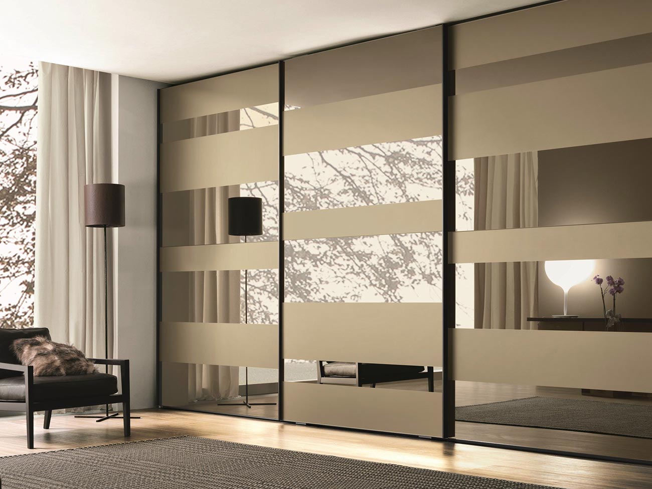 Built-in wardrobe with bronze mirrored sliding doors in a Canberra bedroom